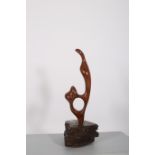 CASEY A YEW WOOD SCULPTURE raised on a slate base of irregular outline signed and dated 1980 66cm