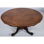 A 19TH CENTURY WALNUT AND MARQUETRY POD TABLE of oval outline the shaped top raised on fluted and