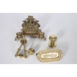 A COLLECTION OF BRASS WARE to include a desk stand letter flap door knockers etc