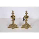 A GOOD PAIR OF 19TH CENTURY BRASS AND STEEL ANDIRONS each with a bulbous upright with flamed finial