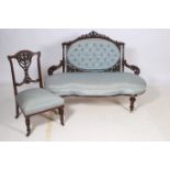 A 19TH CENTURY CARVED MAHOGANY AND UPHOLSTERED SETTEE the pierced carved top rail above an oval