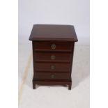 A RETRO MAHOGANY CHEST of rectangular outline the shaped top with four frieze drawers on bracket