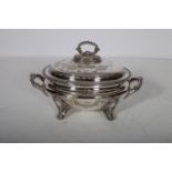 A 19TH CENTURY SILVER PLATED TWO HANDLED LIDDED TUREEN of oval outline with Greek key decoration on