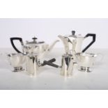 A FOUR PIECE ART DECO SILVER PLATED TEA SET comprising teapot coffee pot jug sugar bowl and milk