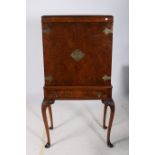 A RETRO WALNUT COCKTAIL CABINET of rectangular outline the shaped top above a pair of blind