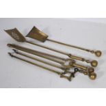 TWO 19TH CENTURY BRASS SHOVELS together with two brass fire tongs (4)