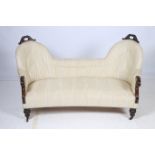 A REGENCY MAHOGANY AND UPHOLSTERED DOUBLE CHAIR BACK SETTEE the shaped back with foliate carved