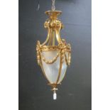 A CONTINENTAL GILT BRASS AND ENGRAVED GLASS SINGLE LIGHT HALL LANTERN of cylindrical tapering form