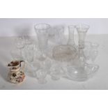 A COLLECTION OF GLASS WARE to include salad bowls decanters vases tumblers etc etc on three shelves