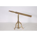 A BRASS DESK TELESCOPIC TELESCOPE on tripod support 53cm (h) x 73cm (w)