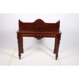 A 19TH CENTURY MAHOGANY SIDE TABLE the rectangular top with carved and moulded back above a