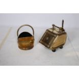 A BRASS LIDDED FUEL BIN with carrying handle together with a brass swing handled fuel bin (2)
