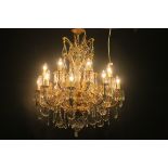 A VERY FINE CONTINENTAL GILT BRASS CUT GLASS SIXTEEN BRANCH CHANDELIER hung in two registers with