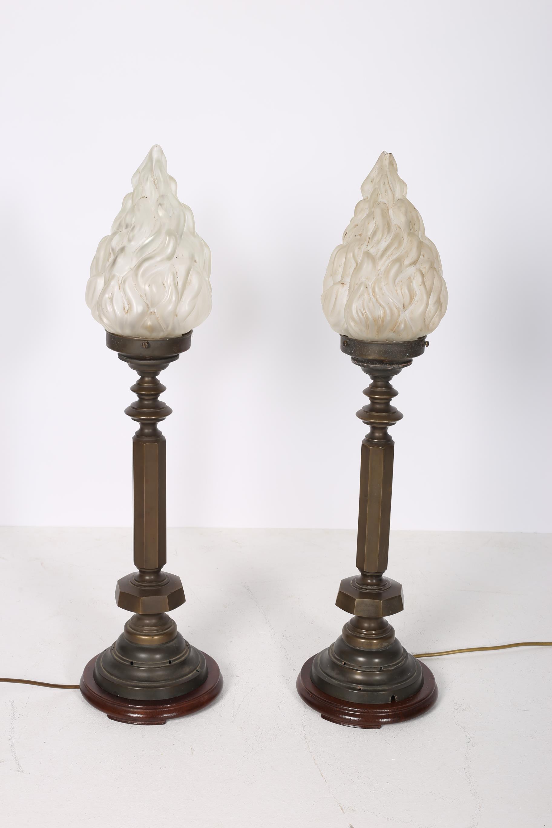 A PAIR OF BRONZE TABLE LAMPS each with an octagonal and turned column above a circular spreading