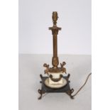 A CONTINENTAL GILT BRASS AND MARBLE TABLE LAMP the reeded column with Corinthian capital above a