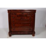 A VERY FINE 19TH CENTURY MAHOGANY CHEST of inverted breakfront outline the shaped top with one long