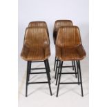 A SET OF FOUR RETRO HIDE UPHOLSTERED AND BLACK METAL HIGH STOOLS each with a shaped panelled back