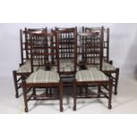 A FINE SET OF EIGHT OAK SPINDLE BACK CHAIRS each with a shaped top rail above baluster splats with