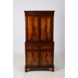 A GEORGIAN DESIGN MAHOGANY CROSS BANDED COCKTAIL CABINET of rectangular bowed outline the shaped
