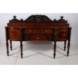 A VERY FINE AND IMPRESSIVE REGENCY MAHOGANY AND SATINWOOD INLAID SIDEBOARD the back carved with neo