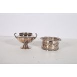 A 19TH CENTURY SILVER PLATED AND COPPER WINE COASTER of cylindrical outline with foliate and