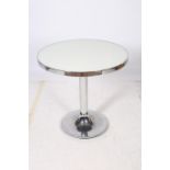 A RETRO CHROME AND GLAZED TABLE of circular outline the shaped top with chrome banding above a
