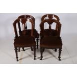 TWO 19TH CENTURY MAHOGANY SIDE CHAIRS each with a curved back and vertical splat with upholstered