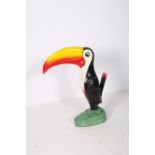 A COMPOSITION AND POLYCHROME FIGURE modelled as a Toucan inscribed Guinness 60cm (h)
