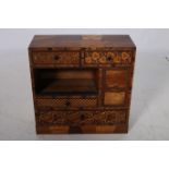 A PARQUETRY DESK CABINET of rectangular outline with frieze drawers and cupboard with open