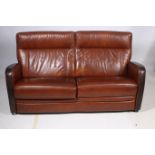 A RETRO TWO TONE HIDE UPHOLSTERED SETTEE the rectangular upholstered back and seat with curved arms