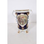 A CONTINENTAL PORCELAIN VASE the flow blue white and gilt ground with central panel depicting a