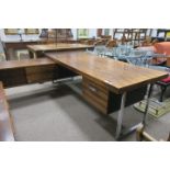 A ROSEWOOD AND CHROME DESK with extension of rectangular outline with frieze drawers and cupboards