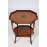 AN ORIENTAL HARDWOOD TWO TIER FOLDING TABLE the octagonal dish top raised on moulded supports