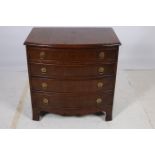 A GEORGIAN DESIGN MAHOGANY CROSS BANDED CHEST of demilune outline the shaped top above four long