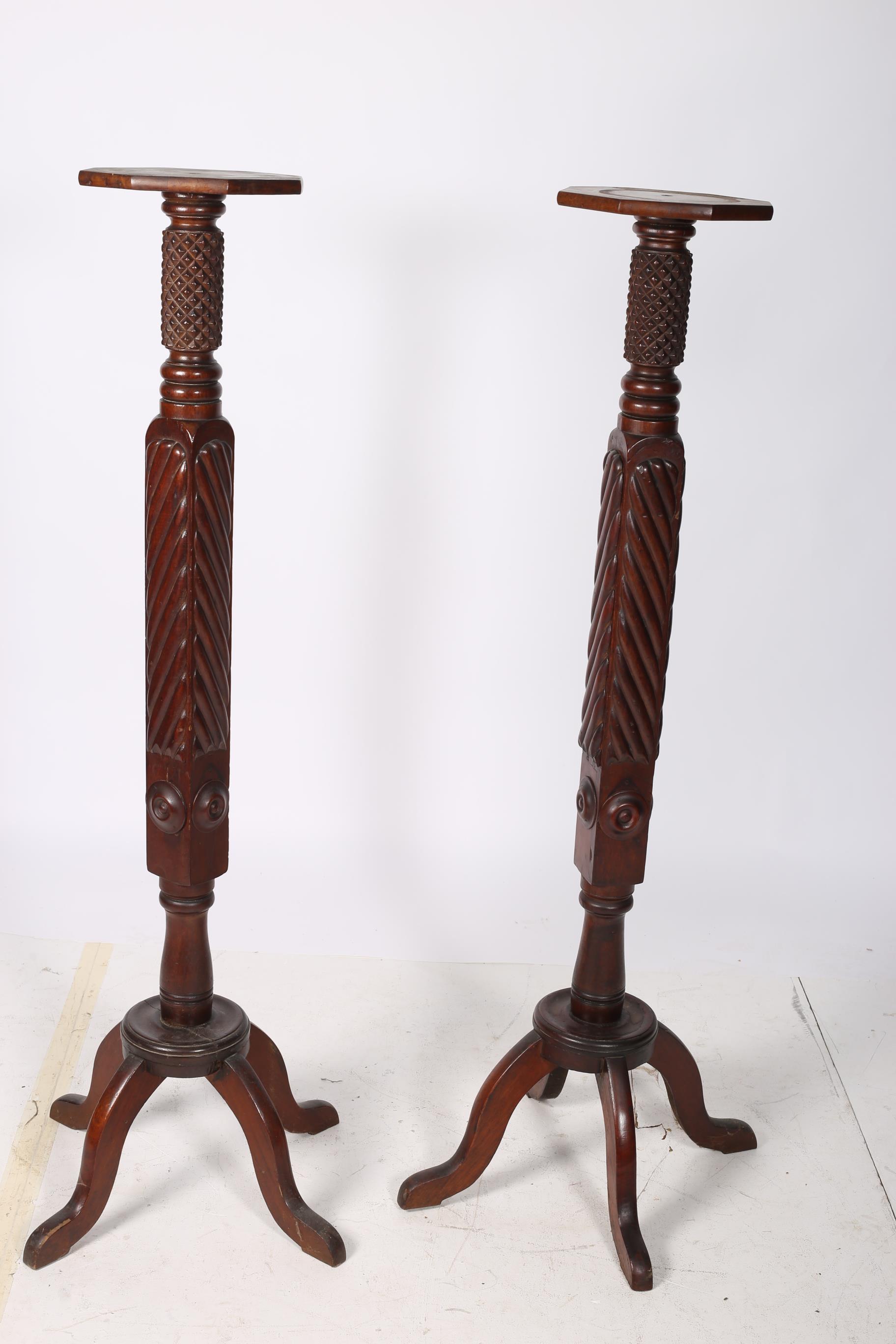 A PAIR OF 19TH CENTURY MAHOGANY JARDINIERE STANDS each with an octagonal top the carved and ring