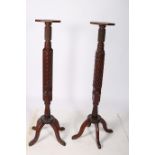 A PAIR OF 19TH CENTURY MAHOGANY JARDINIERE STANDS each with an octagonal top the carved and ring