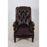 A WILLIAM IV MAHOGANY LIBRARY CHAIR the carved top rail above a button upholstered back and seat