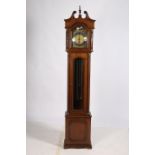 A MAHOGANY LONG CASE CLOCK the architectural hood above a gilt brass and silvered dial with Roman