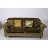 A VICTORIAN DESIGN THREE SEATER SETTEE the rectangular upholstered back and seat with loose