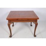 A MAHOGANY DRAW LEAF TABLE the rectangular top raised on cabriole legs with pad feet 76cm (h) x