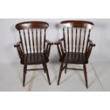 A MATCHED PAIR OF HARDWOOD WINDSOR CHAIRS each with a curved top rail and spindle splats with