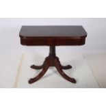 A REGENCY MAHOGANY FOLD OVER SUPPER TABLE the rectangular hinged top with reeded rim above a tablet