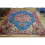 A TABRIZ WOOL RUG the light blue light pink and wine ground pattern with central panel filled with