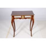 A CONTINENTAL KINGWOOD MARQUETRY AND GILT BRASS MOUNTED TABLE of rectangular outline with eared