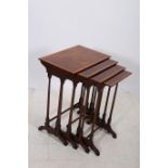 A NEST OF FOUR MAHOGANY AND SATINWOOD CROSS BANDED TABLES each of rectangular form on dual ring