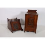 A 19TH CENTURY MAHOGANY SLOPE FRONT FUEL BIN with carved panel and carrying handle together with a