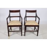 A GOOD PAIR OF REGENCY MAHOGANY ELBOW CHAIRS each with a curved top rail and splat with reeded arms