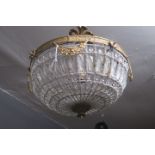 A CONTINENTAL GILT BRASS AND CUT GLASS CEILING LIGHT of bulbous tapering outline inset with faceted