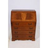 A MAHOGANY AND SATINWOOD INLAID BUREAU the rectangular hinged writing slope with tooled leather