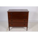 A 19TH CENTURY MAHOGANY INLAID CHEST of rectangular outline the shaped top above four long drawers